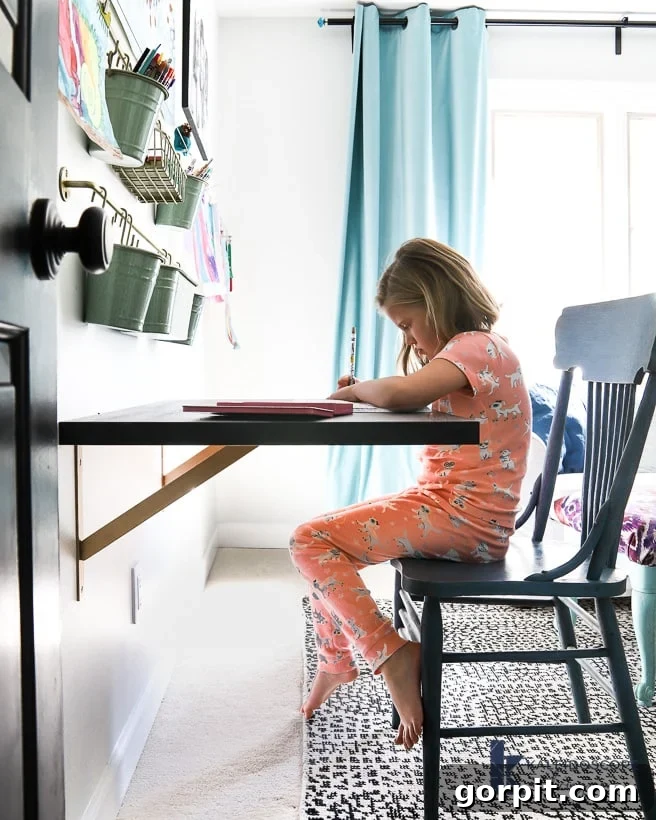 finished DIY floating desk by Tasha Agruso of Kaleidoscope Living, showcasing a modern and organized kids' room workspace