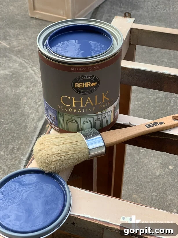 Chalk Paint Furniture Makeovers Step by Step 6 Applying Behr Chalk Decorative Paint in Timeless Blue to furniture, showcasing the smooth application of chalk paint.