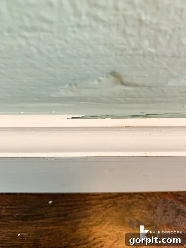 Easy Ways to Repair Chipped Baseboards 9 Comparison showing baseboard trim with caulk versus without caulk, highlighting the finished look and seamless transition