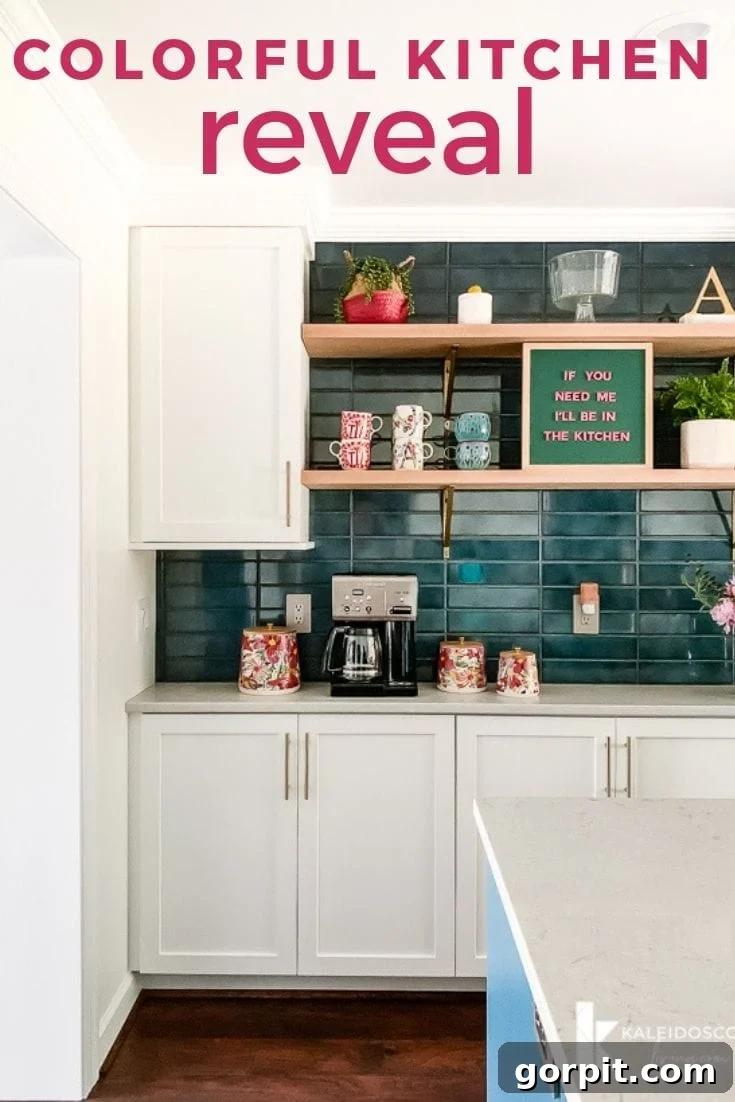 Vibrant Kitchen Transformation Unveiled 2 colorful kitchen after wall removal, featuring a large teal island and white cabinets