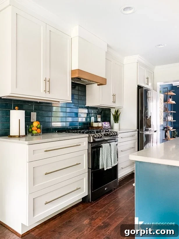 Vibrant Kitchen Transformation Unveiled 10 white and teal kitchen with modern stacked tile backsplash, showcasing contemporary design elements