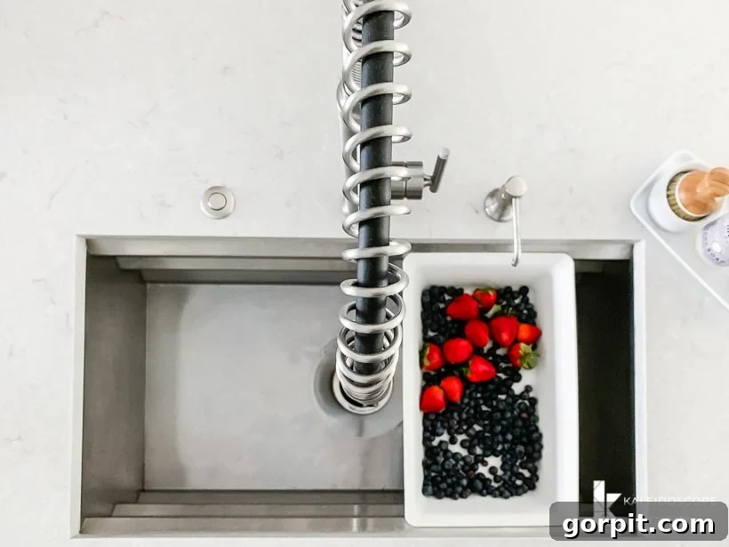 Vibrant Kitchen Transformation Unveiled 18 kohler prolific sink, showing its deep basin and integrated features