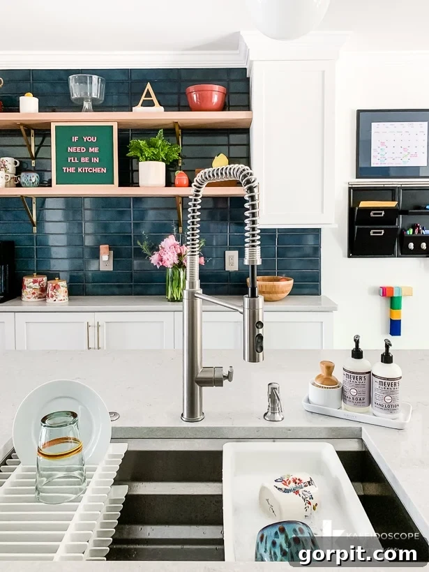 Vibrant Kitchen Transformation Unveiled 19 kohler prolific sink in white and teal kitchen, demonstrating its stylish integration