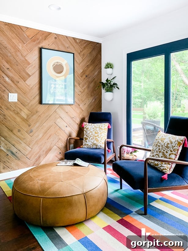 Vibrant Kitchen Transformation Unveiled 21 colorful seating area in kitchen, featuring blue velvet lounge chairs and leather ottoman
