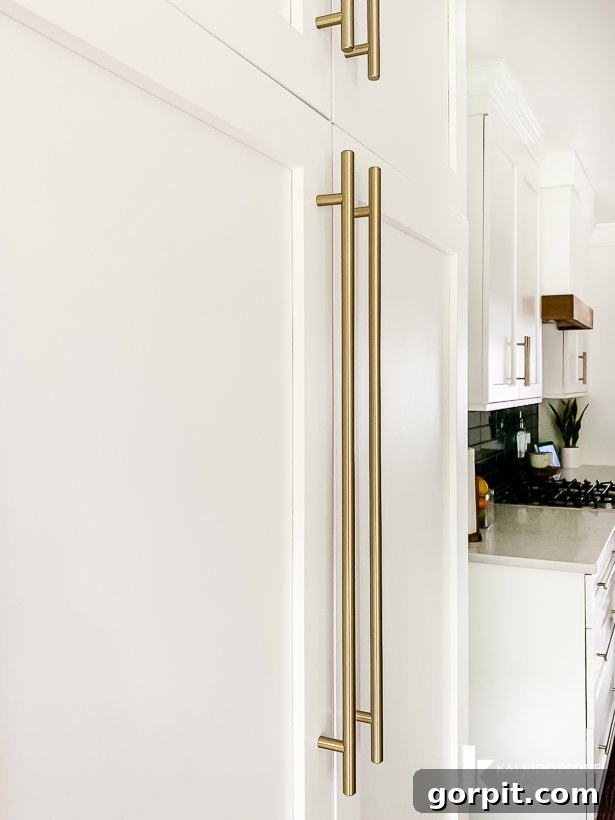 Vibrant Kitchen Transformation Unveiled 25 Amerock golden champagne bar pulls on pantry cabinets, showing elegant hardware choice