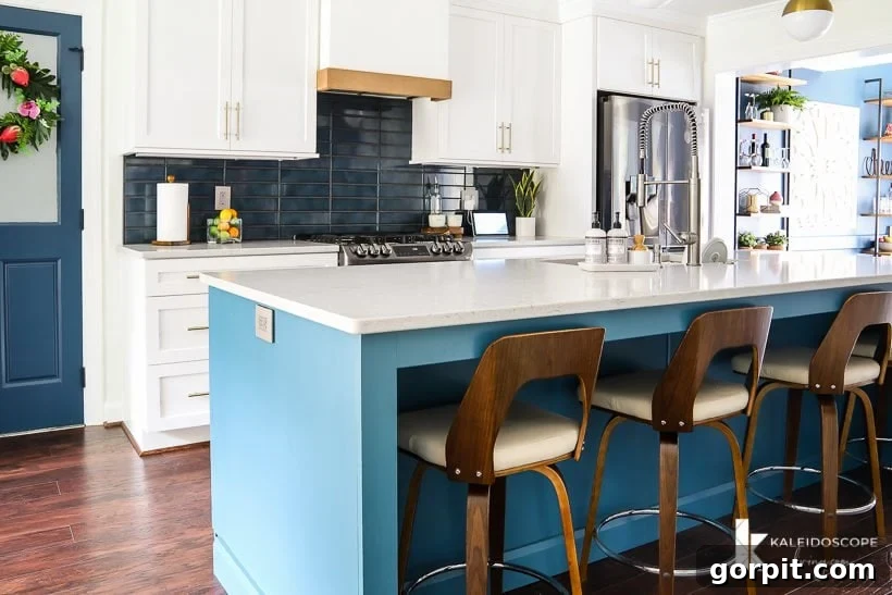 Vibrant Kitchen Transformation Unveiled 7 white and teal modern kitchen, showcasing the open concept after wall removal