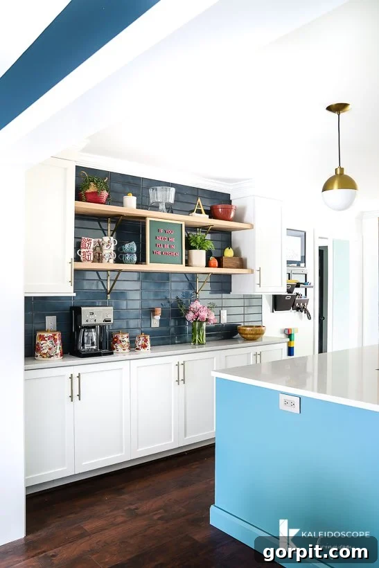 Vibrant Kitchen Transformation Unveiled 8 white and teal kitchen open to dining room, emphasizing the seamless flow between spaces