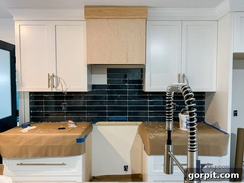 DIY Wood and White Concrete Range Hood 4 dark blue kitchen backsplash tile with unfinished range hood