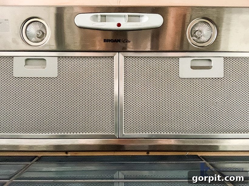 DIY Wood and White Concrete Range Hood 5 broan elite range hood fan installed underneath framing