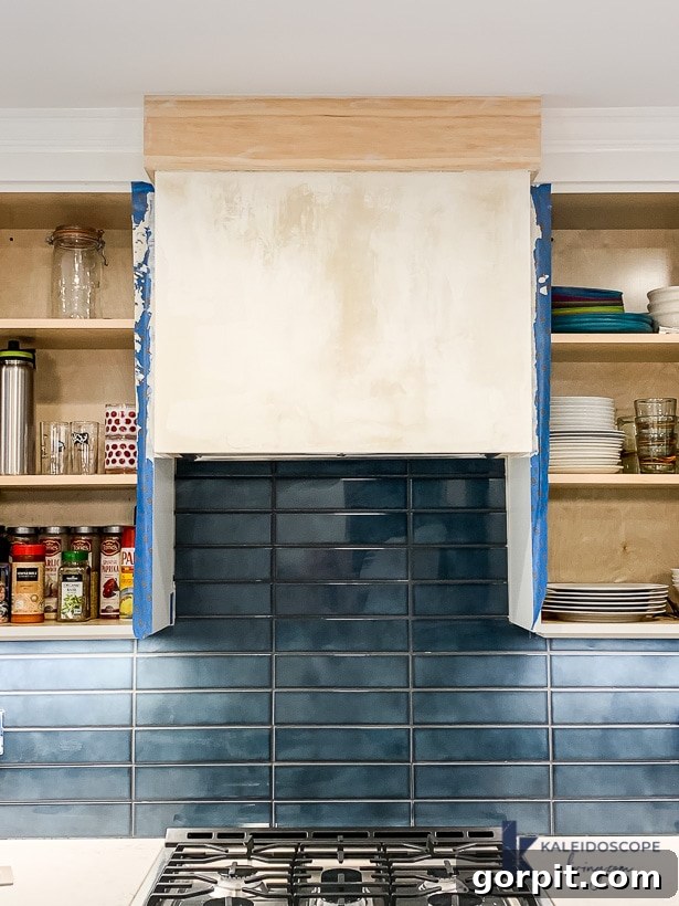 DIY Wood and White Concrete Range Hood 9 white skimcoat on range hood drying second coat