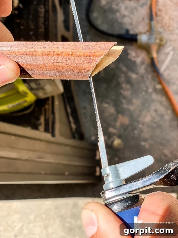 Your Guide to Perfect Quarter-Round Molding 5 Hands use a small thin coping saw to cope the quarter round molding for an inside corner joint. The website KaleidoscopeLiving.com is in the right-hand bottom corner.