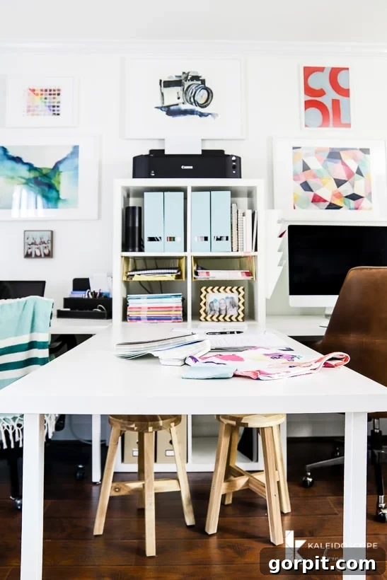 Stylish home office with a colorful and feminine aesthetic, featuring a double desk setup and strategic storage.