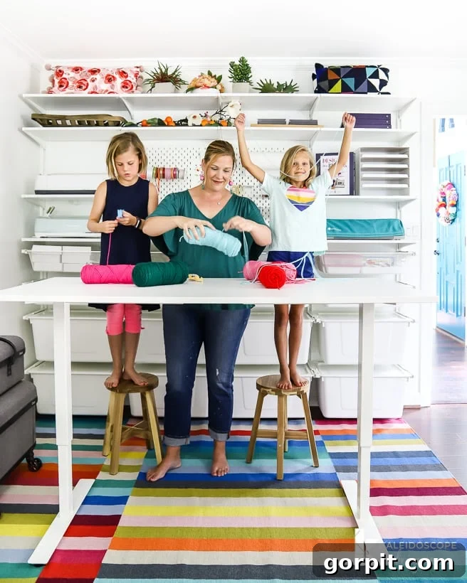 Colorful craft room showcasing IKEA Algot storage and a versatile adjustable standing table for various creative projects.