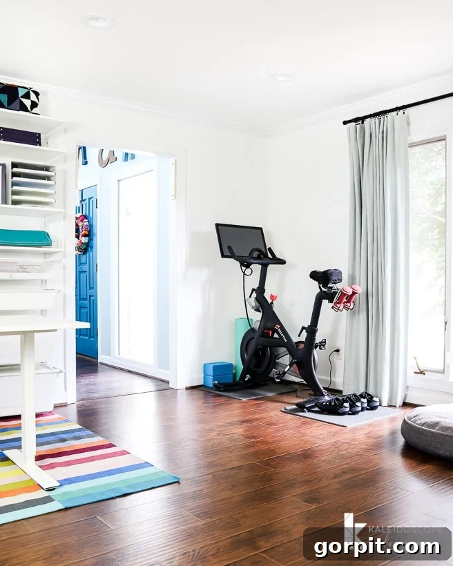 Peloton exercise bike integrated into a home office/craft room, demonstrating functional space utilization in a real home.