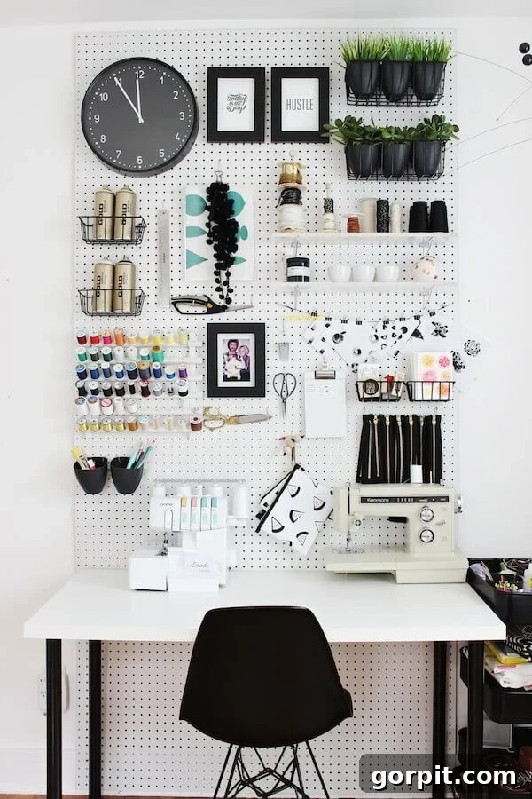 Ultimate Craft Room Organization 3 Pegboard craft room storage ideas in a chic black and white space, maximizing vertical organization.