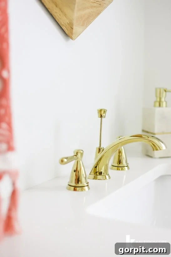 Delta Peerless Faucet in polished brass, highlighting its sleek design and reflective surface.