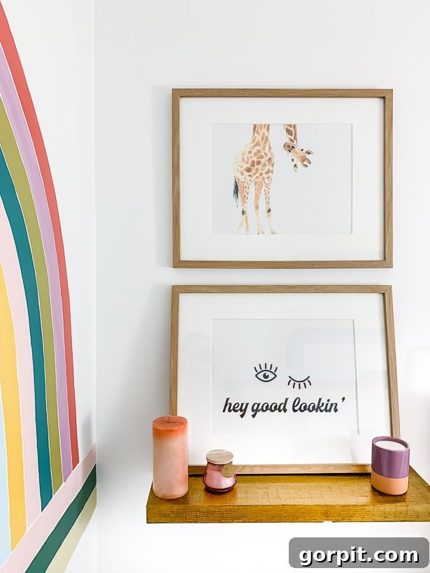 Colorful modern powder room remodel featuring custom artwork above the toilet.