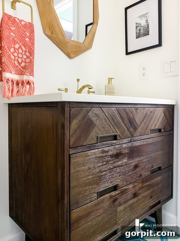 Close-up of the Signature Hardware Danenburg vanity with herringbone pattern and mid-century legs.