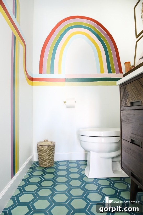 Modern and colorful cement tile flooring in a DIY bathroom remodel, showcasing geometric patterns.