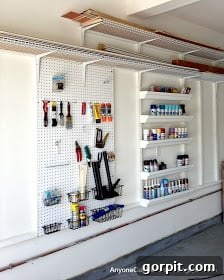 simple pegboard and gutter shelves garage organization 