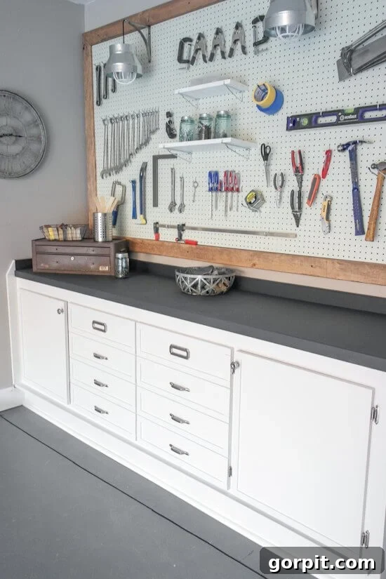 organized workbench and pegboard in a garage