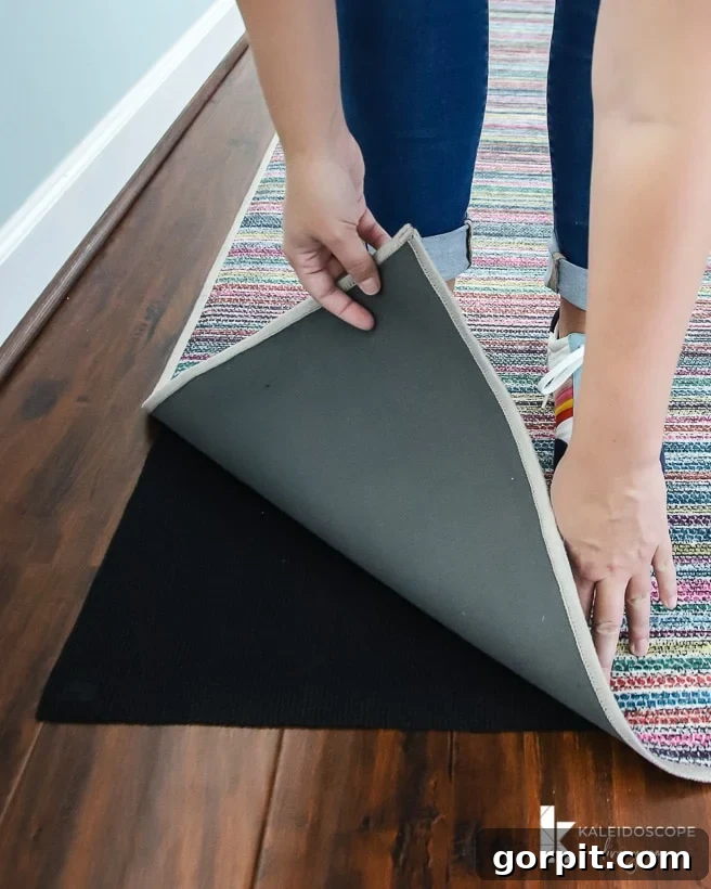 Upstairs Hallway's Colorful Glow-Up 5 Installing Ruggable rug in a long hallway