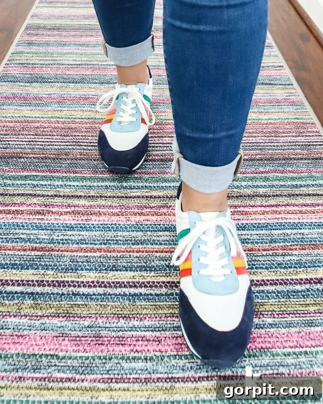 Upstairs Hallway's Colorful Glow-Up 6 Detailed view of the Ruggable Multi Stripe Polychrome runner in a hallway