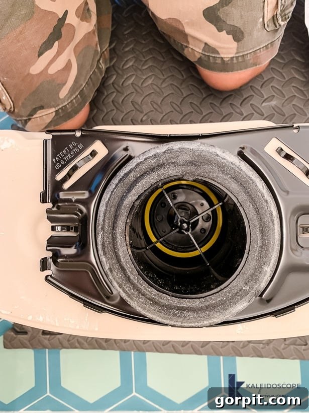 Attaching the toilet tank to the bowl, ensuring proper gasket and bolt alignment