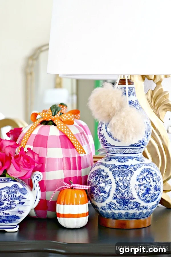 Chic and Affordable DIY Fall Decor 5 gingham painted pumpkins in fall vingnette