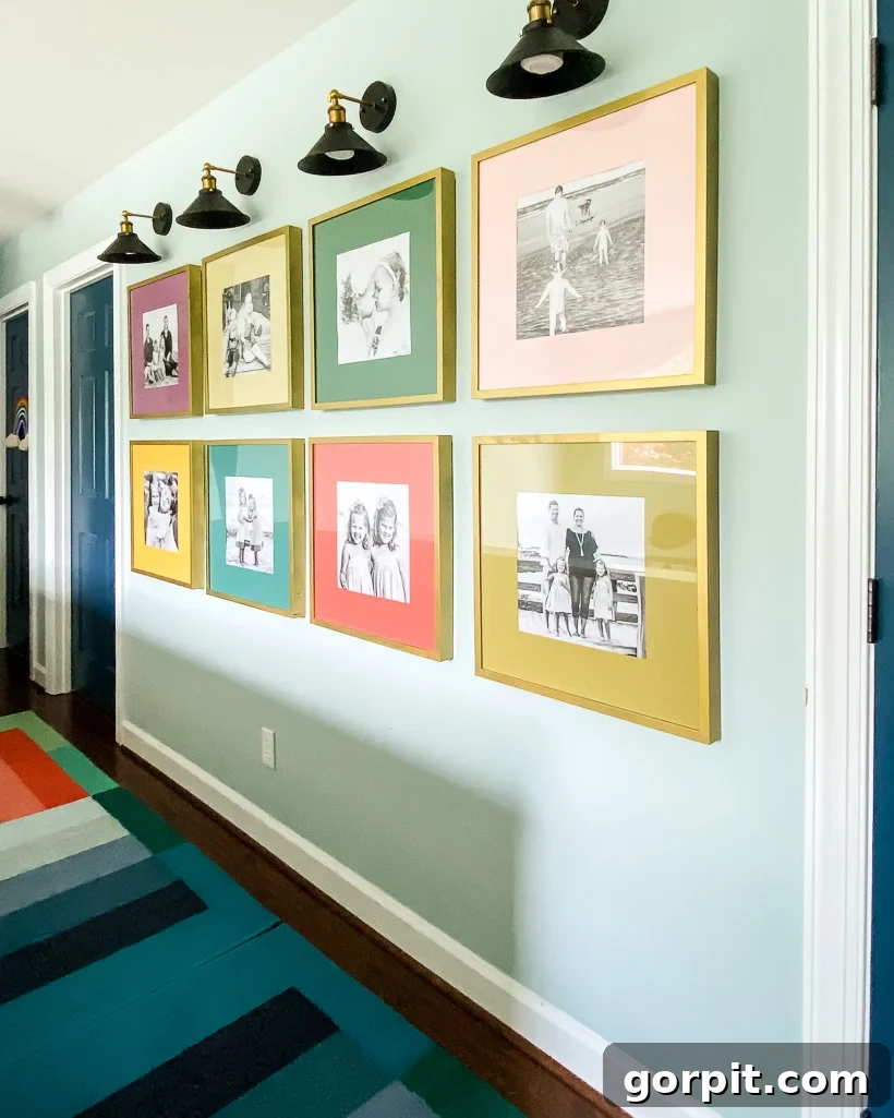 Gallery wall featuring colorful photo mats and black frames