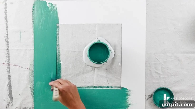 Painting picture photo mats with vibrant colors for a DIY photo gallery wall