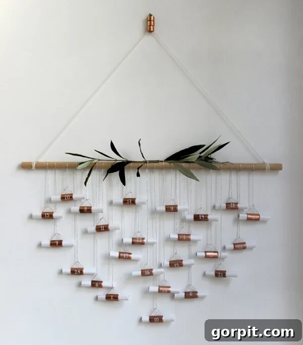 hanging copper pipe advent calendar with small gifts