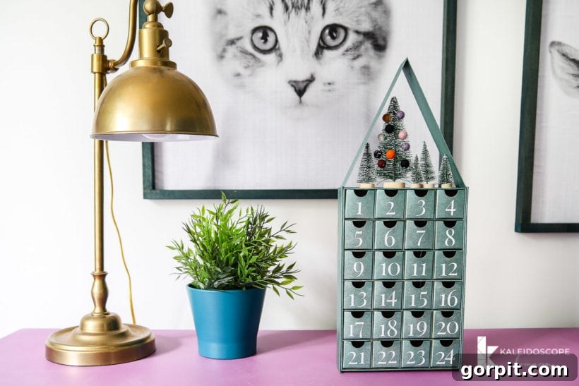 Detailed view of the metallic blue-green DIY Advent calendar, showcasing its stylish design and sparkling details.