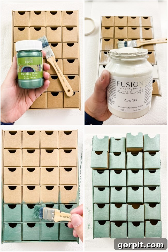 Paper mache Advent calendar being painted with a metallic blue-green color, showing the initial stage of personalization.