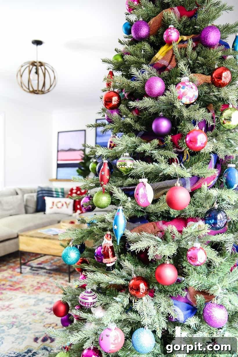 Vivacious Holiday Tree 6 Close-up of bright and colorful Christmas ornaments nestled in the lush green branches of a Christmas tree, with soft-focus festive lights creating a magical glow