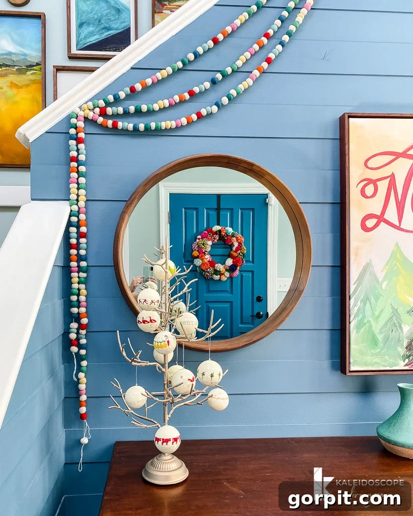 A Christmas Kaleidoscope Home Tour 3 colorful foyer decorated for Christmas