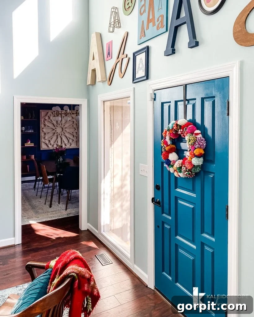 A Christmas Kaleidoscope Home Tour 4 colorful typography wall and christmas wreath
