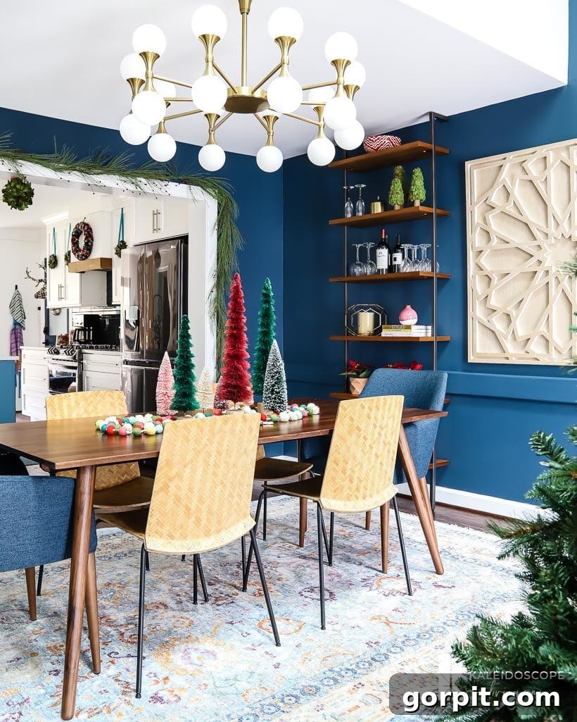 A Christmas Kaleidoscope Home Tour 5 mid-century modern dining room decorated for Christmas