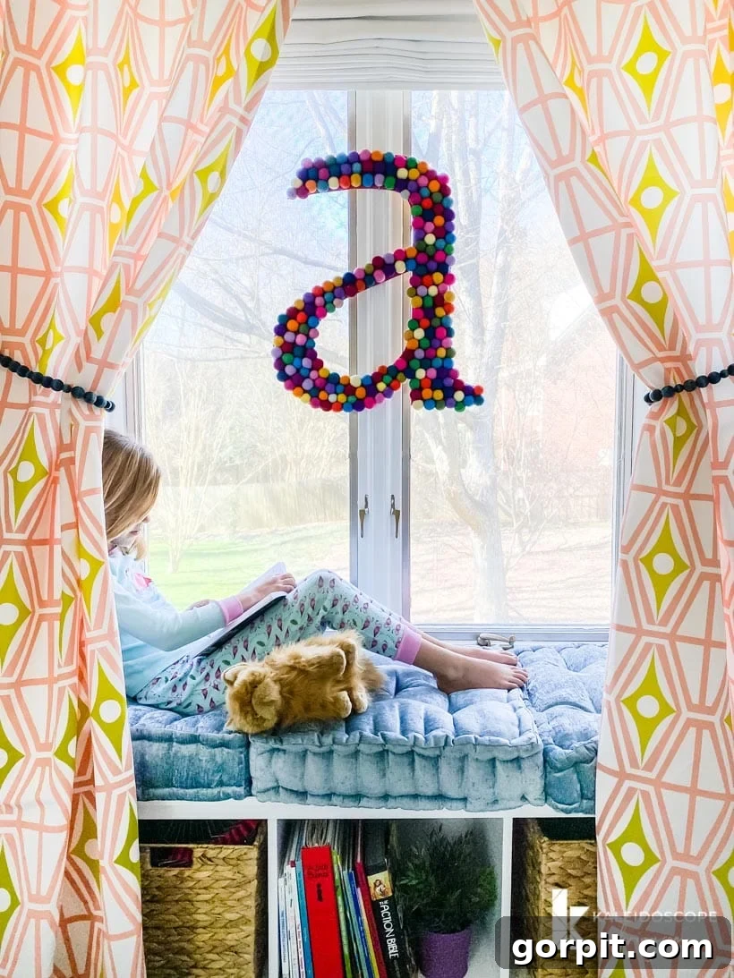 Colorful girl's bedroom featuring a window seat reading nook, adorned with cushions and storage baskets.