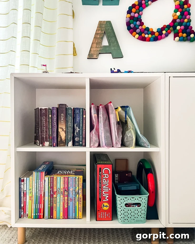 Taming Playroom Chaos: Smart Storage Solutions 6 Playroom bookcases showcasing zippered pouches used for board game storage