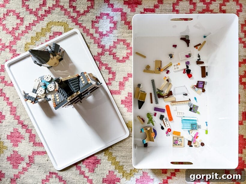 Taming Playroom Chaos: Smart Storage Solutions 10 Lego creation built on a storage bin lid in the playroom