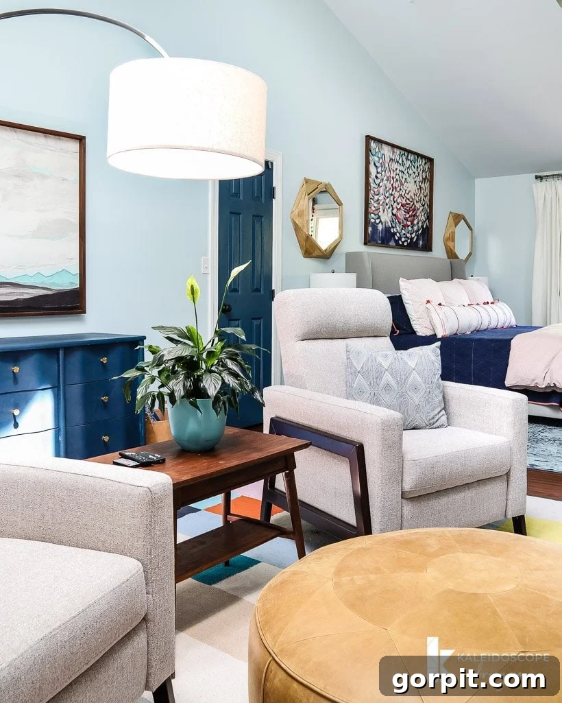 Cozy colorful bedroom featuring a stylish sitting area with recliners
