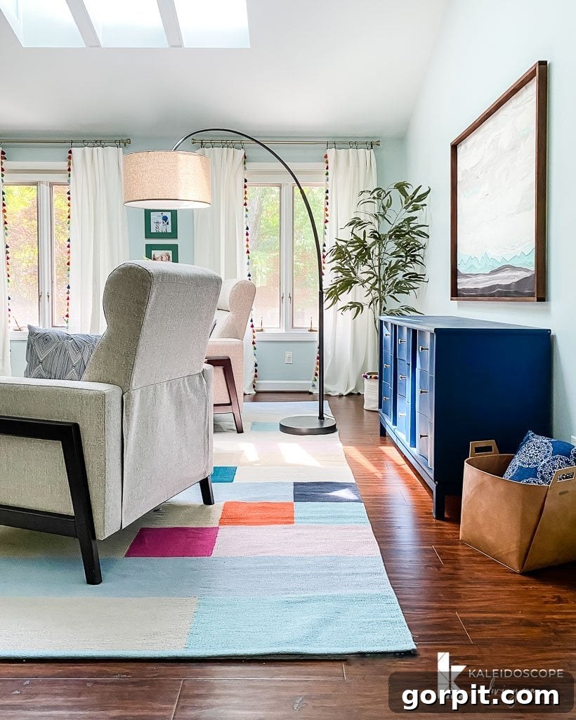 Colorful and inviting seating area in the master bedroom with a stylish rug