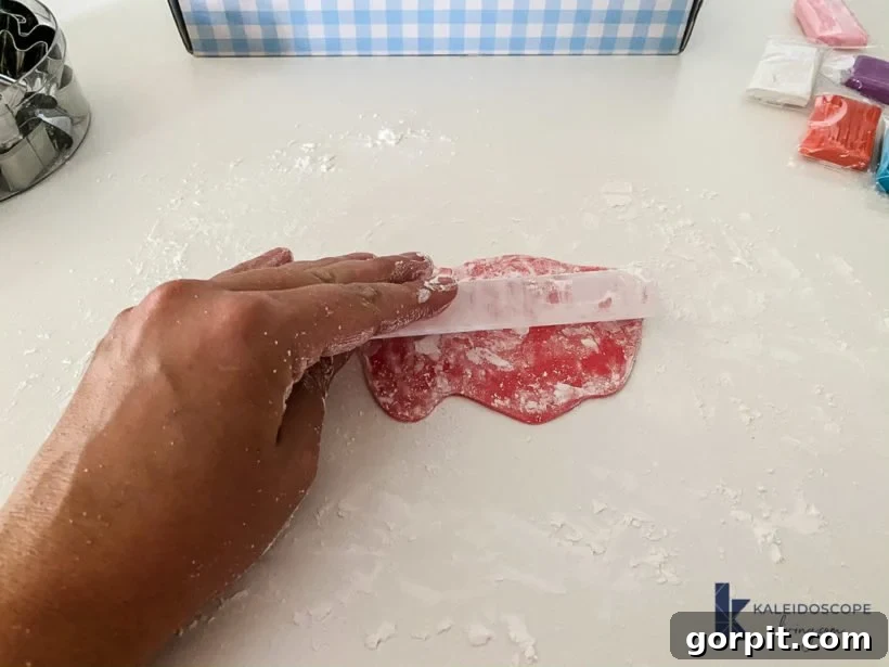 Rolling out polymer clay with an acrylic roller on a corn-starched surface