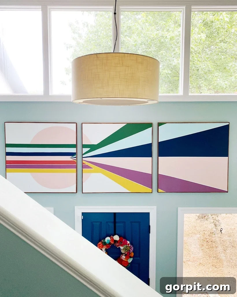 A Burst of Summer: My Colorful Home Unveiled 8 Grand foyer with large-scale DIY mural canvases in vibrant colors, creating a striking first impression.