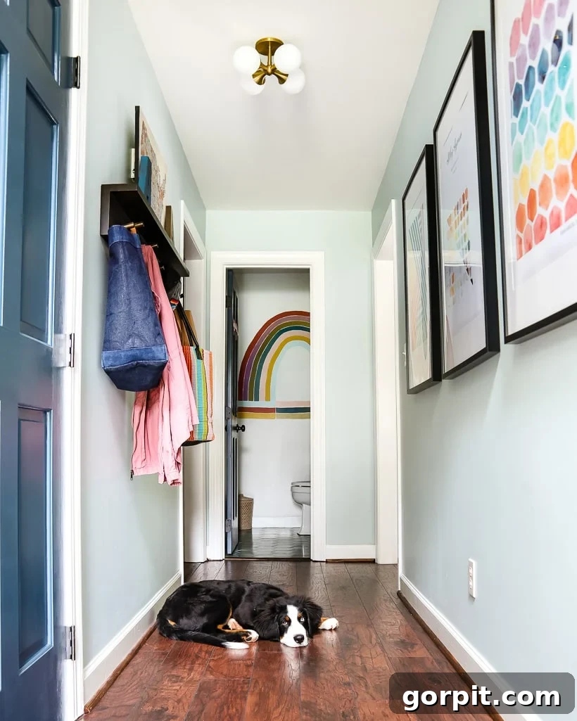 A Burst of Summer: My Colorful Home Unveiled 10 Vibrant downstairs hallway featuring personalized art created by children and the homeowner, creating a lively and colorful passage.