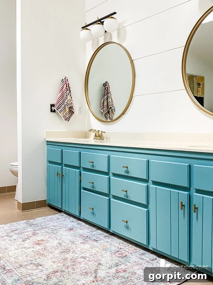 Dream Master Bath on a Budget Revealed 10 turquoise painted vanity with modern lights