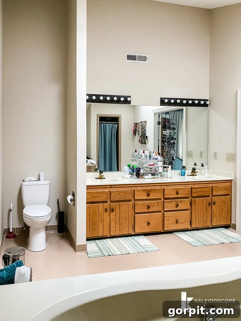 Dream Master Bath on a Budget Revealed 5 outdated bathroom with wood vanity and heavy curtains