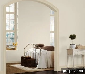 Bedroom with warm ivory trim accentuating the windows and baseboards against a backdrop of clean white walls, creating a serene and inviting space.