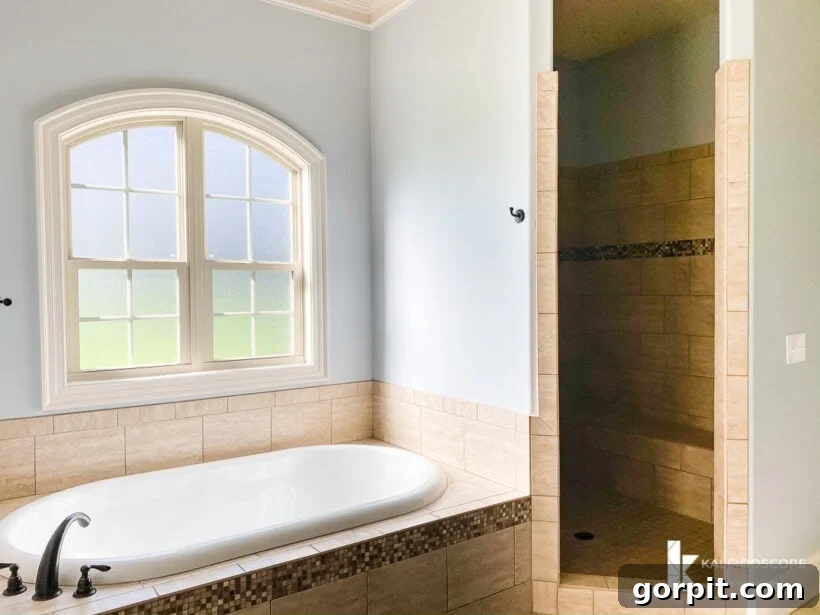 Our New House: The Starting Point Tour Part 1 15 Corner view of the master bathroom showcasing a large soaking tub and a spacious walk-in shower.